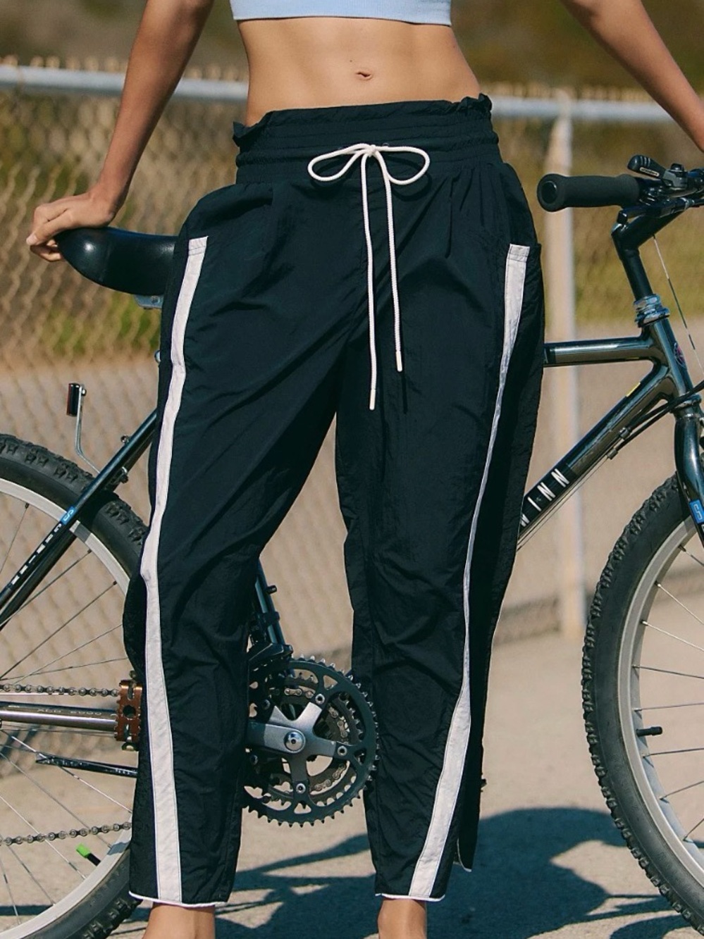 FP Movement ‘Champ is Here’ Black Track Pants with White Side Stripes - Picture 4 of 6